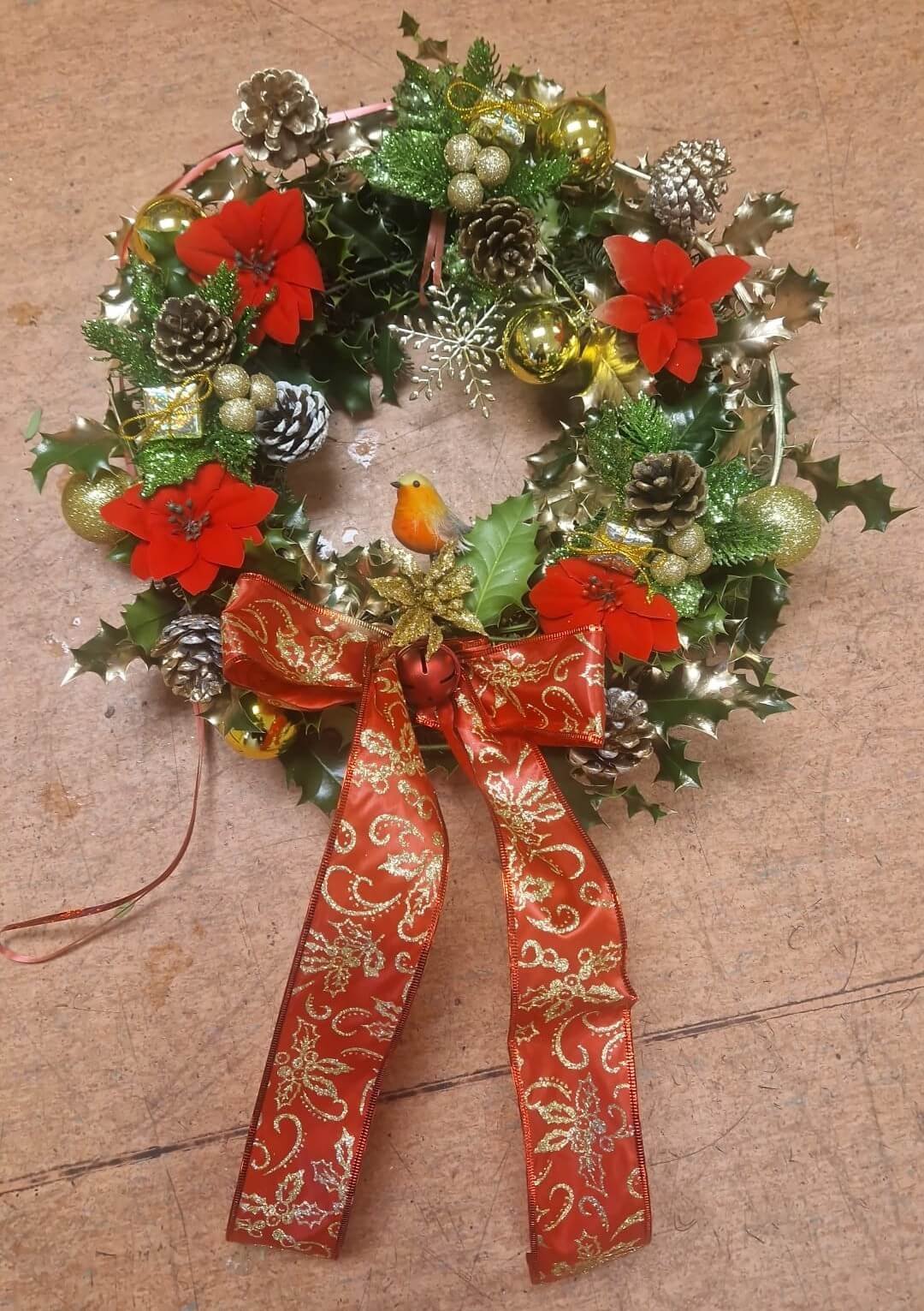Door wreath with seasonal foliage and berries