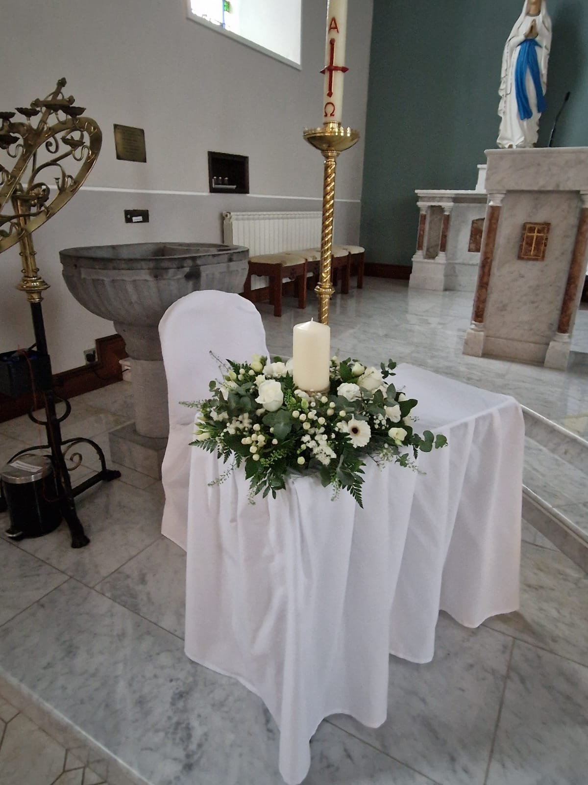Pedestal flowers at church entrance